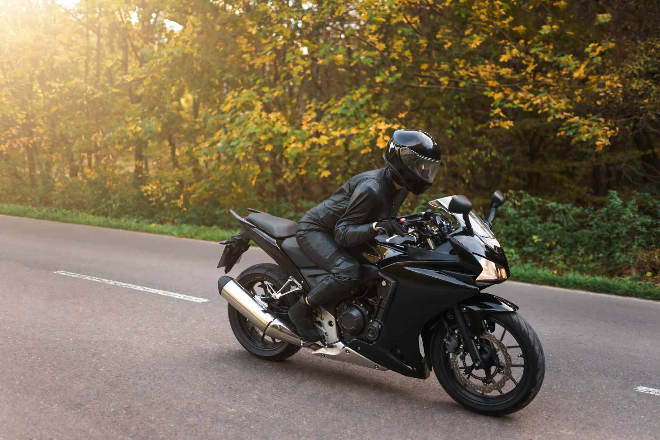biker on a sports motorcycle rides on the highway